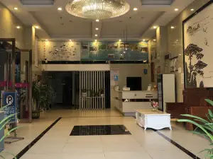 Q+ Nanxiong Xinhewan Business Hotel