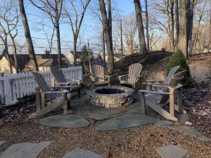 Charmer with lake views, hot tub, fire pit, and short walk to private beach.