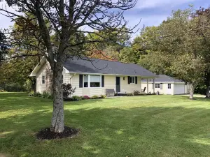 Charming, recently updated country ranch home on quiet, scenic, acre lot.