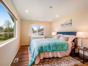 Soundfront home with WiFi, washer/dryer, central AC, and enclosed yard