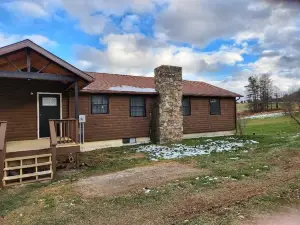 Cozy  home located on 10 acres with a pond for fishing and kayaking.