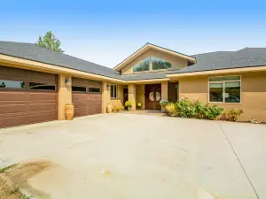 Stunning home on 20 acres with orchard views, lovely patio/balcony & sunroom