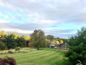 Dog-Friendly Cottage w/ Creek, Barn, Game Room, Fire Pit, Hot Tub, Sleeps 10