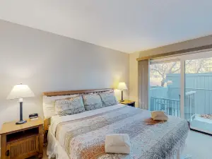 Lovely waterfront condo with lake access, fireplace, deck, river views, W/D