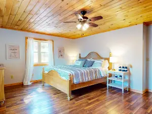 Dog-friendly lakefront house with hot tub, central AC, & mountain view