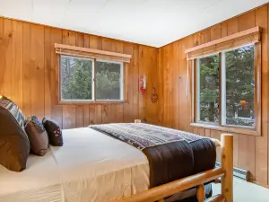 Lakefront Home with a Private Dock, Deck, Fireplace, Spacious Yard, & Playset