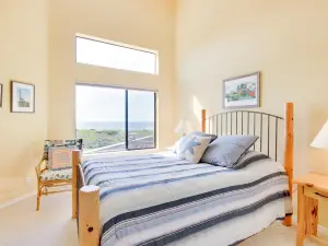 Oceanfront house with shared pool, private hot tub, modern decor, & meadow views