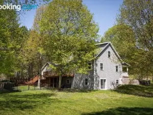 Maple City Farmhouse with a Private Setting Between Traverse City and Empire