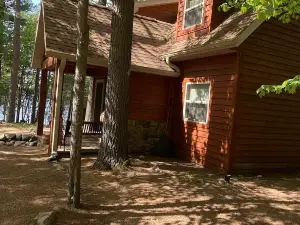 Beautiful, comfortable 2 bedroom cabin with a loft on a lake in the woods.