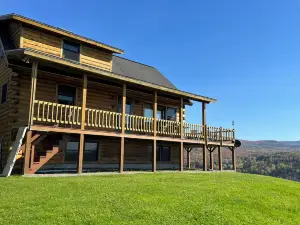 Log Cabin on 6 Acres w Direct Snowmobile Trail Access, Mountain Views & Sunsets