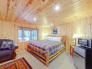 Riverfront cabin with large yard, great deck, & fireplace
