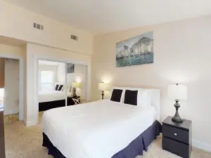 Comfortable townhome steps from beach with pool access, balcony, & W/D