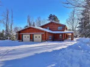 Scandinavian hand-scribed full log home on 31 acres and a quiet lake and trails