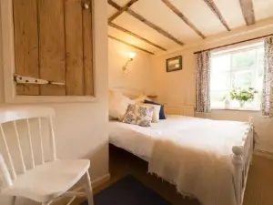 Spadgers, a Flax Workers Cottage Next to Fields in a Medieval Village
