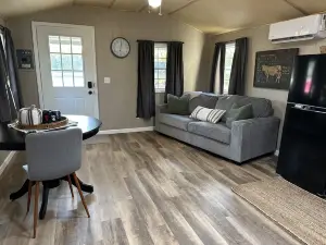 This tiny cabin is a peaceful place complete with stocked pond and kayaks!