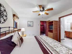 Valley-view condo w/ a large kitchen, stone-front fireplace, & private patio