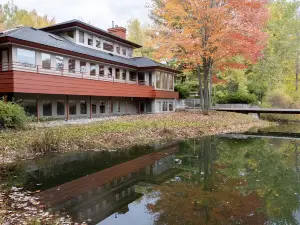 Mid-Century Modern Retreat on Private 10 Acres with 1-Acre Pond & Nature Trails.