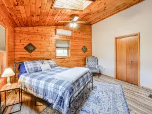 Dog-friendly home with private pond, wraparound porch & fireplaces