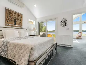 Dog-friendly lake escape with sunroom, high-speed WiFi, water views & central AC