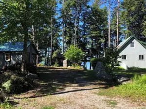 Cozy, Off-Grid Camp on Spectacle Pond w/ private water frontage!