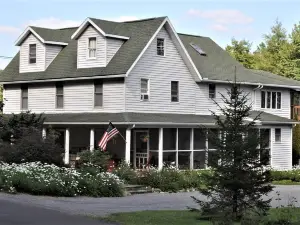 Two Bedroom Across from Outlet Pond on edge of village and wooded trails.