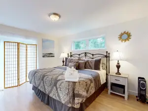 Sunny coastal retreat with deck, grill, wood stove, beach, dock, & ocean access