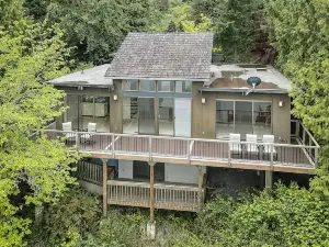 Pacific NW Mid-Century Modern Waterfront Gem Located on Raft Island 3 Bedroom Home by Redawning