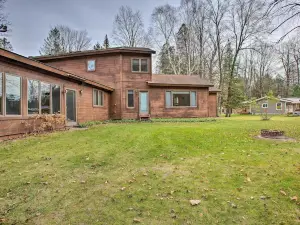 Riverfront Manton Cabin with Pool Table and Fire Pit!