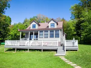 Lakefront family getaway;large dock;private boat ramp;Pretty cottage;large deck!