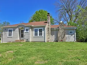Charming 2-bedroom cottage in scenic Southwest MO with a large corner lot.
