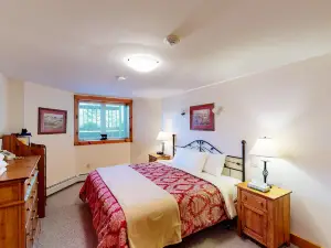 Walk to lifts basement condo near water park & golf course with deck