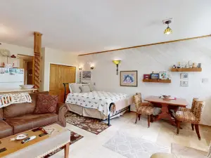 Amazing condo with river & mountain views, hot tub, & wood-burning fireplace