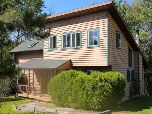 Lakeside cabin with Hot Tub and full kitchen!  Sleeps up to 12 people.