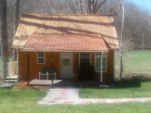 Quaint, secluded cabin with the feel of home. Sleeps 4 with home-like amenities.