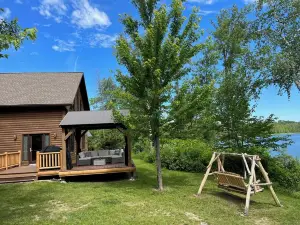 Beautiful Log Cabin With Sandy Beach.  Lake Is Known For Its Great Fishing!