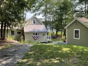 Lakeside camp with private beach, dock and so much more!