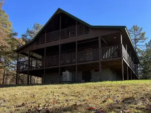 Beautiful cabin with fireplace and wrap around porch and private upstair balcony