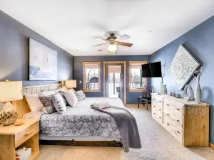 Condo at waterfront resort with golf course views, central AC, W/D, & pool