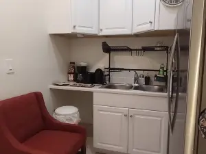 Guest Suite by Ameridency: 1 King Bed, 1 Bath with Rain Shower, Full Kitchen