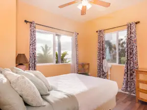 Spectacular two-story ocean-view home on two acres with covered lanai