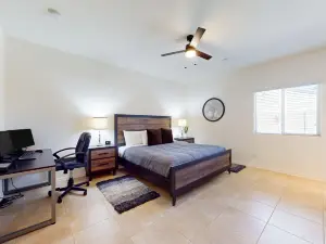 Airy desert home with an enclosed yard, private pool, hot tub, firepit, & W/D