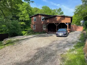 Large family mountain retreat on Buck Run with a stocked pond in Leetonia Pa.