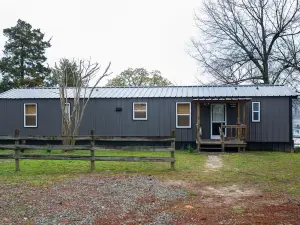 Lake front retreat, covered boat dock, large deck , fenced play area, RV parking