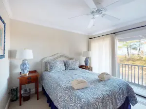 Riverfront condo with beach access to lake, fireplace, furnished deck & cable