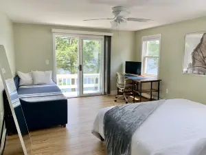 Lakefront home with deck, game room, washer/dryer, grill, dock, & views