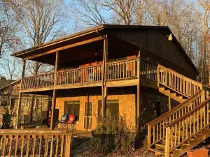 Scenic lake house with private covered dual-slip and two covered lake-view decks