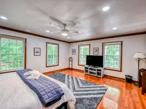 Lakefront home in private location with dock, firepit, game room & large deck