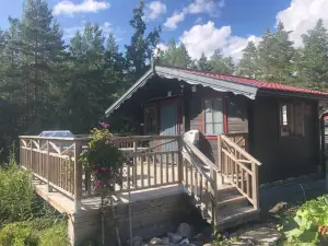 Timber Cottages with Jacuzzi and Sauna Near Lake Vänern