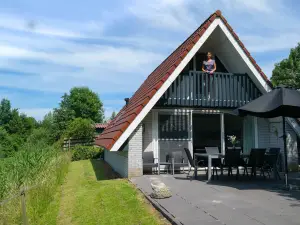 6 Pers. House with Sunny Terrace at a Typical Dutch Canal & by Lake Lauwersmeer.