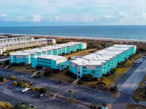 1st-floor pool-view condo with outdoor pool, beach access, balcony, W/D, & AC